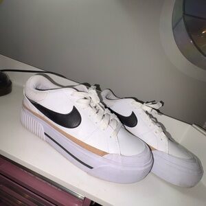 Nike Women's White and Black Sneakers with Gold Accents